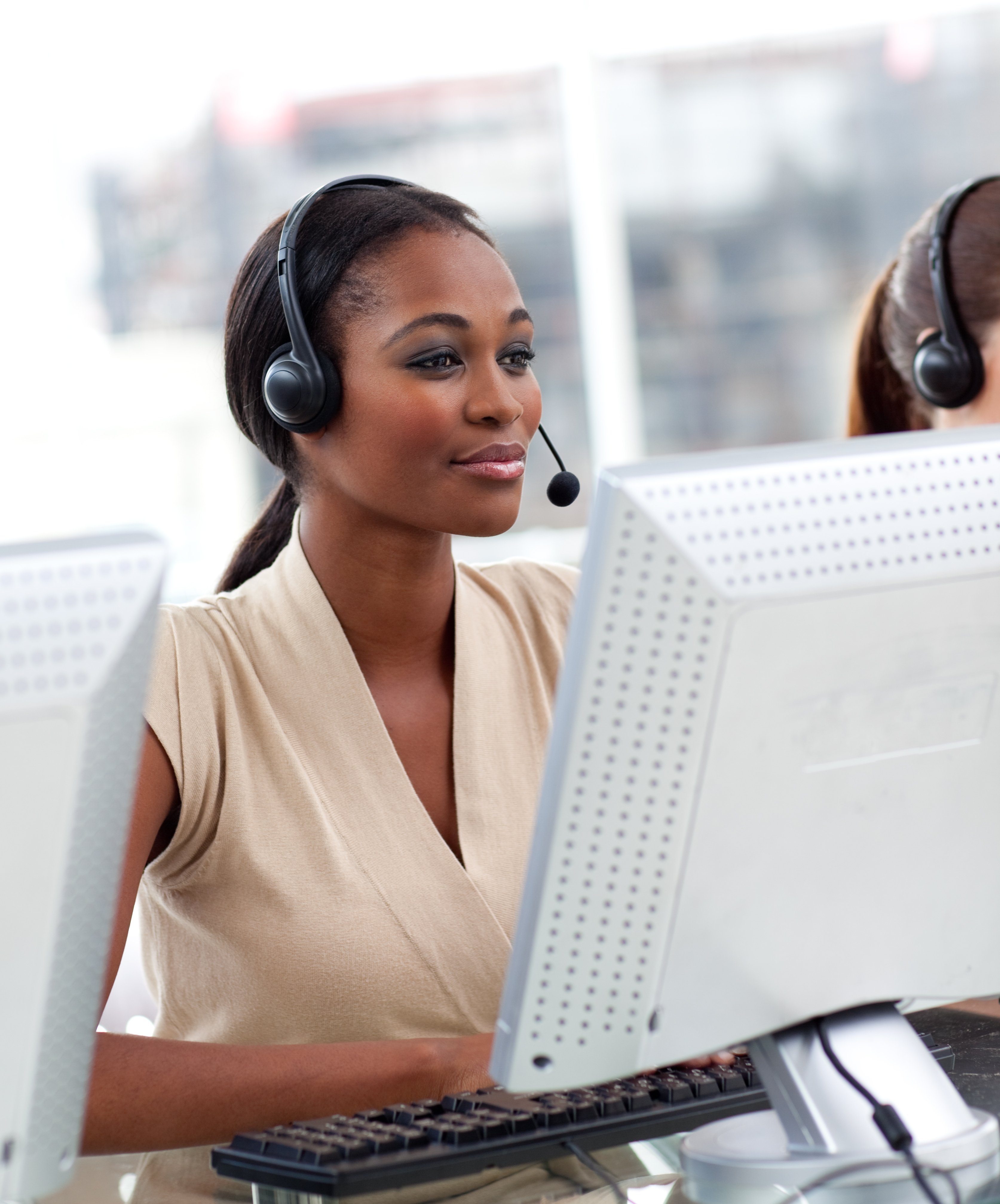serious-ethnic-businesswoman-working-call-center
